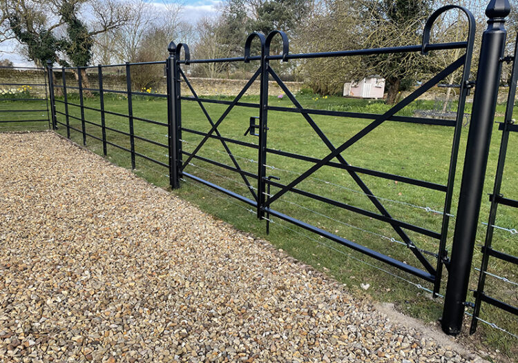 pair of bowtop gates with line wires for dogs or livestock