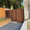 Stepped woven fence with incorporated gate