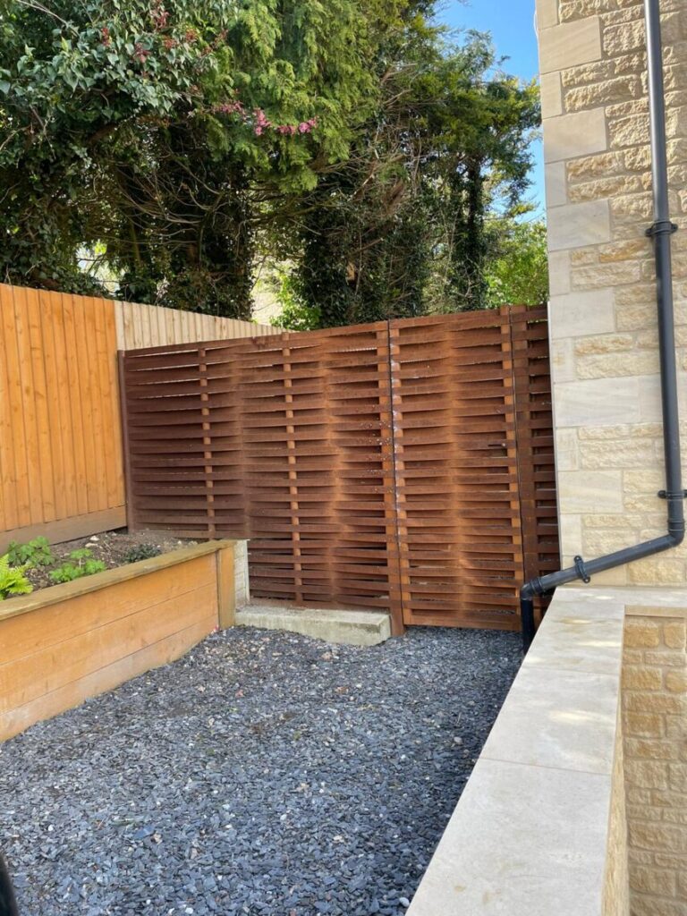 Stepped woven fence with incorporated gate