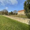 estate fencing behind wall