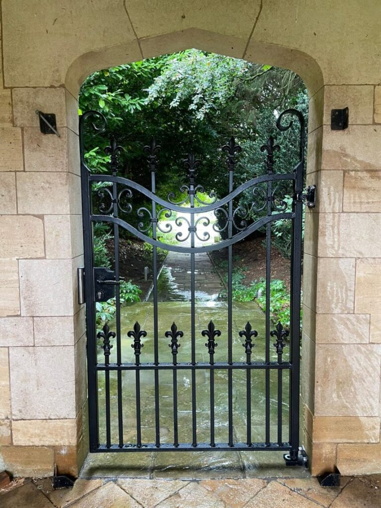 Decorative gate with decorative hand latch and keep
